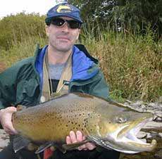 Salmon River fishing guides Brown Trout in Pulaski NY. With a Nice Brown Trout landed.