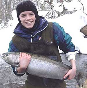 Winter Steelhead fishing Salmon River Pulaski NY. Thomas lands a 16 pound steelhead with help from this fly fishing guide.