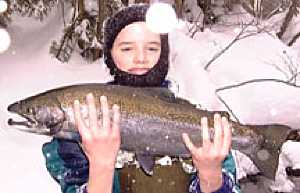 Winter Steelhead fishing Pulaski NY. Thomas lands a 6 pound steelhead with guide.