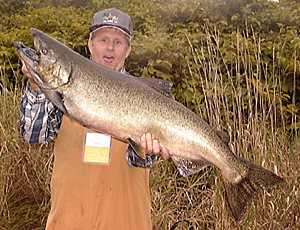 Clint fish's the Salmon River and lands a BIG 30 lb. King Salmon.