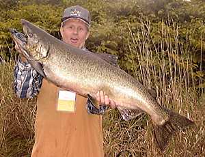 Clint fish's the and lands a BIG 30 lb. King Salmon.