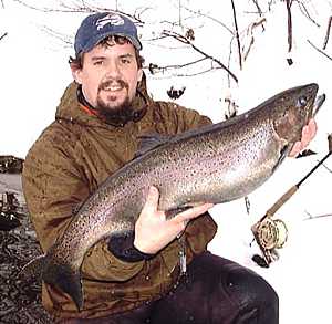 Salmon River Fishing Testimonials for Pulaski NY with Bill landing a nice steelhead.