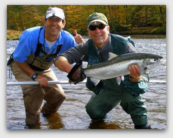  Steelhead trout fishing on the Salmon River in Pulaski NY during the Fall with fishing guide and a Happy Steelhead Guest.