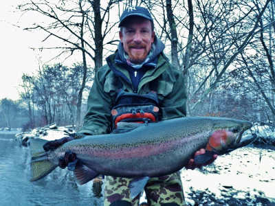 Salmon River guide fishing Pulaski NY for Steelhead and Salmon with Tom catching a nice 16 pound steelhead. - The Yankee Angler.